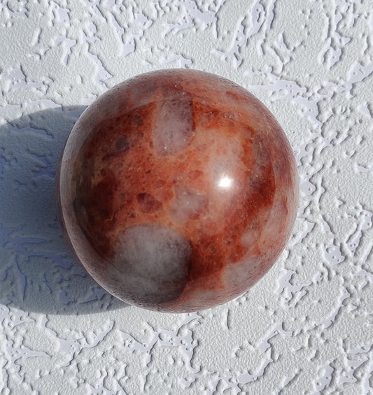 Brazilian hematoid quartz sphere with red and golden inclusions